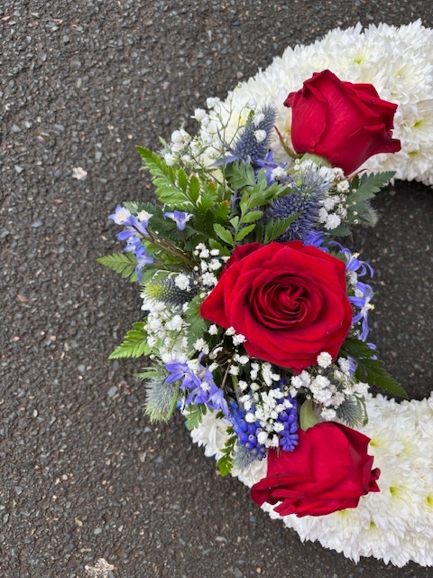 White massed wreath with spray